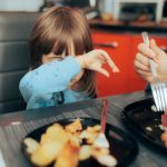 Little child rejecting food